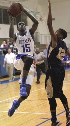 Kaleb Turner drives to the rack. (Photo by Rick Nation)