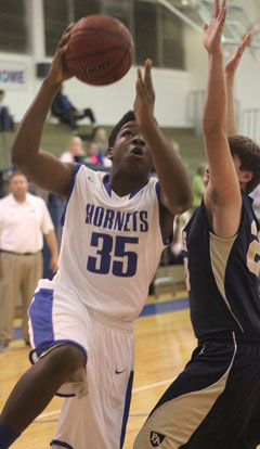 John Winston (35) goes up for a shot. (Photo by Rick Nation)