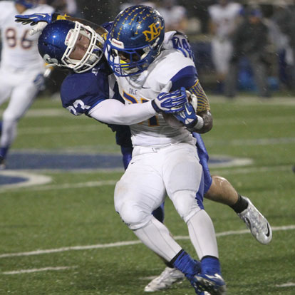 Bryant's Hunter Fugitt (33) tries to wrap up North Little Rock running back Deon Tidwell. (Photo by Rick Nation)