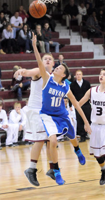 Garrett Cowart (10) scoops up a shot under the basket. (Photo by Kevin Nagle)