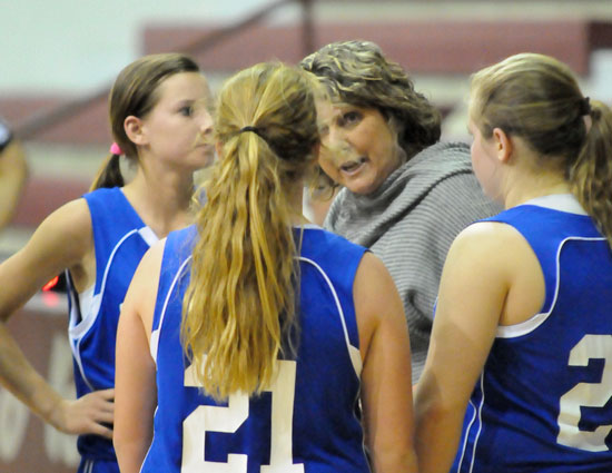 Bethel coach Rhonda Hall talks with Baylee Rowton (21) and her Lady Hornets during a timeout. (Photo by Kevin Nagle)