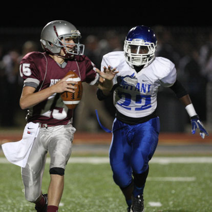 Bryant's Phillip Isom-Green bears down on Benton quarterback Nate Beck. (Photo by Rick Nation)