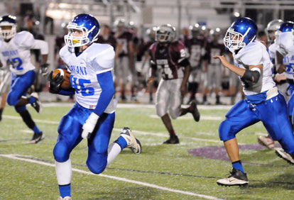 Hayden Knowles heads toward the end zone after his interception. (Photo by Kevin Nagle)