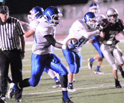 DeAmonte Terry scores with the help of teammate London Taylor's block. (Photo by Kevin Nagle)