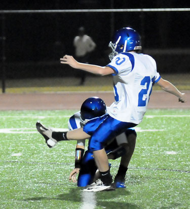 Luke Welch follows through a kick from the hold of Cameron Vail. (Photo by Kevin Nagle)