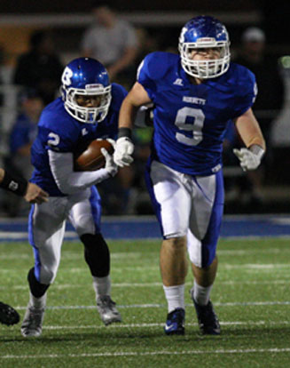 Brushawn Hunter (2) follows Wesley Akers (9) upfield. (Photo by Rick Nation)