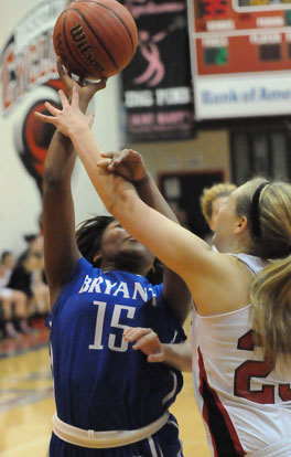 Jayla Anderson has her forearm hit as she tries to get a shot away. (Photo by Kevin Nagle)