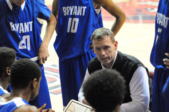 Bryant head coach Mike Abrahamson talks to his players during a timeout. (Photo by Kevin Nagle)