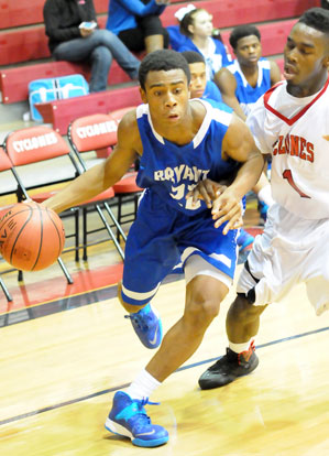 Freshman Romen Martin tries to drive past Russellville's Co-Chese Temple Laws. (Photo by Kevin Nagle)