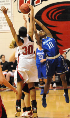 Jakeria Otey (10) has her shot blocked by Russellville's Shaneka Ealy. (Photo by Kevin Nagle)