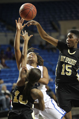 Jayla Anderson tried to get a shot off in traffic. (Photo by Rick Nation)