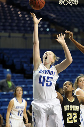 Rachel Miller gets a shot up as teammate Maddie Baxter (12) looks on. (Photo by Rick Nation)