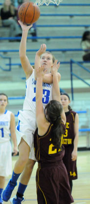 Kendal Rogers (23) shoots over Lake Hamilton's Emily Burkholder. (Photo by Kevin Nagle)