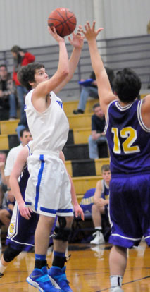 Caleb Strain shoots over Matthew Cronin. (Photo by Kevin Nagle)