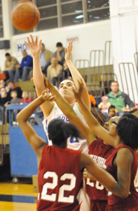 Whitney Meyer is fouled on her shot in a crowd. (Photo by Kevin Nagle)