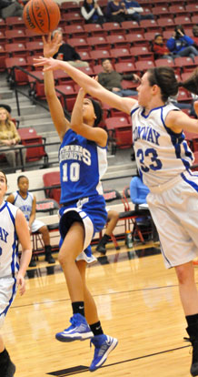 Anne Marie Keith (10) goes in for a layup between Conway White's Hailey Estes, left, and Savannah Lowe. (Photo by Kevin Nagle)