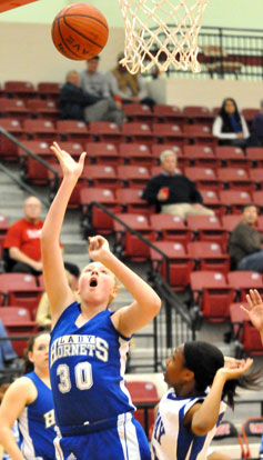 Rachel Miller (30) follows through on a jump hook. (Photo by Kevin Nagle)