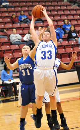 Carolyn Reeves (31) contests a rebound by Conway White's Savannah Lowe. (Photo by Kevin Nagle)