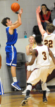 Tyler Simmons launched a 3 over Lake Hamilton's Harrison Watkins. (Photo by Kevin Nagle)