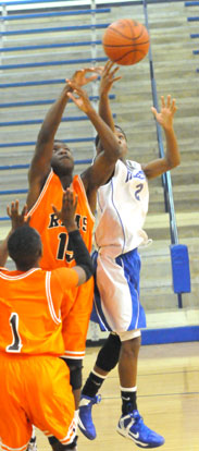 Desmond Duckworth (2) scoops up a shot. (photo by Kevin Nagle)