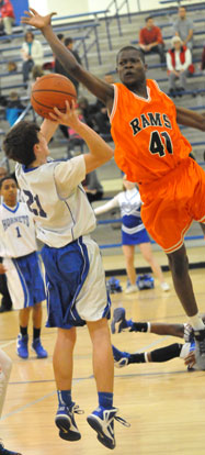 Hunter Handly (21) falls away to get a shot away over a Ridge Road defender. (Photo by Kevin Nagle)