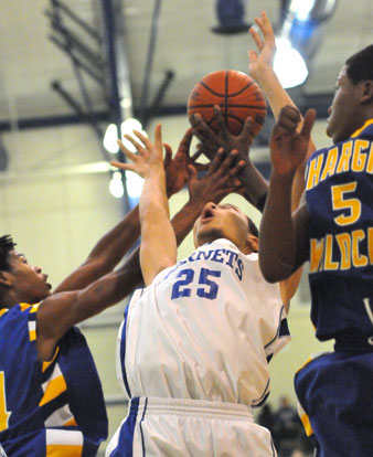 Jaelynn Jones (25) tries to rebound with the North Little Rock Junior Chargiing Wildcats. (PHoto by Kevin Nagle)