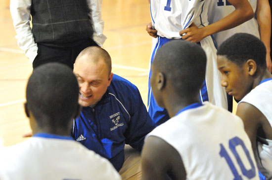 Bryant Blue head coach Derek McGrew talks to his team during a timeout. (Photo by Kevin Nagle)