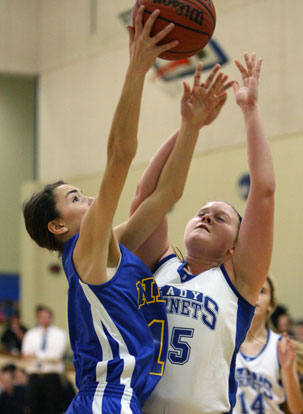 Bryant's Anna Turpin (25) battles for a rebound with North Little Rock's Reagan Sperling. (Photo by Rick Nation)