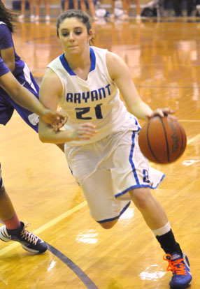 Courtney Davidson tries to drive around an El Dorado defender. (Photo by Kevin Nagle)