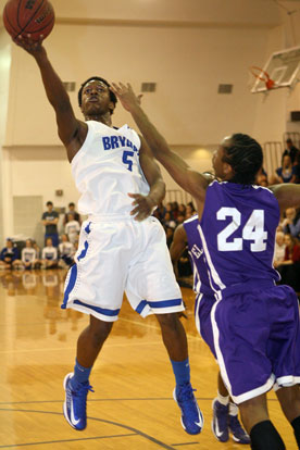 K.J. Hill (5) shoots over El Dorado's Chris White. (Photo by Rick Nation)