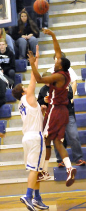 Zach Cambron, left, defends against Pine Bluff's Tyrone Payne. (Photo by Kevin Nagle)