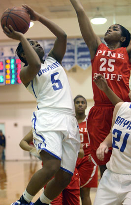 Dezerea Duckworth (5) tries to get a shot past Pine Bluff's Johniece Tate. (Photo by Rick Nation)