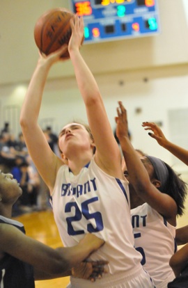 Erica Smith winces as she's hit while trying to shoot. (Photo by Kevin Nagle)