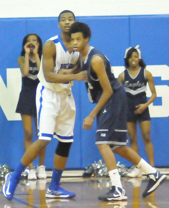 Bryant's Brian Reed, left, applies some defense. (Photo by Kevin Nagle)