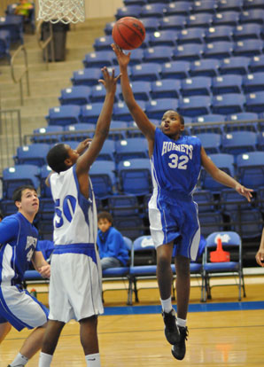 Jonathan Harris lofts a shot over a Conway Blue defender. (Photo by Kevin Nagle)