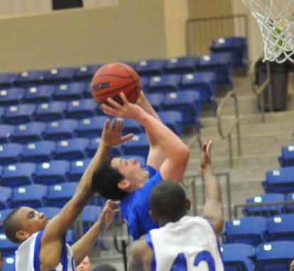 Hayden Knowles powers up a shot in a crowd. (Photo by Kevin Nagle)