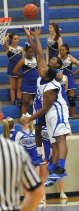 Kris Croom goes high to get a shot over Conway Blue's Kris Patrick. (Photo by Kevin Nagle)