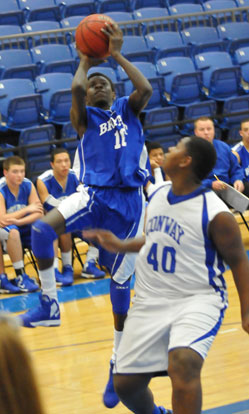 Bryant's Kevin Hunt goes up for a shot over Conway Blue's Kris Patrick. (Photo by Kevin Nagle)