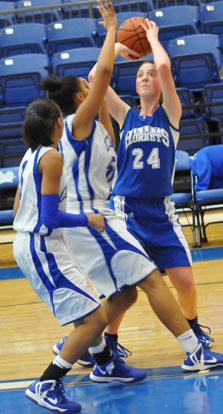 Britney Sahlmann (24) sets to take a shot over Conway Blue's Futra Banks. (Photo by Kevin Nagle)