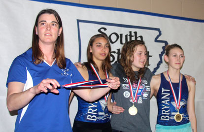 Bryant coach Angel Dale with three of the members of the all-District 200 IM relay, Reagan Smith, Katie Higgs and Libby Thompson.