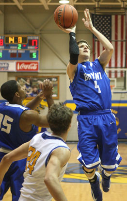 Luke Rayburn (4) goes up for a shot in front of teammate Brian Reed and Sheridan's Brady Bowlin. (Photo by Rick Nation)