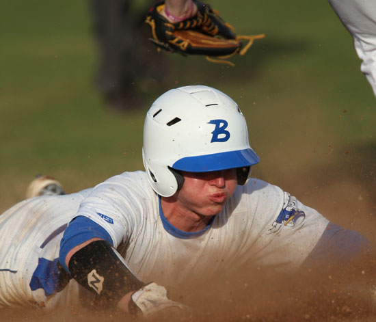Bryant's Tyler Green dives back into first on a pickoff play. (Photo by Rick Nation)
