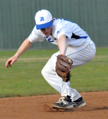 Trevor Ezell makes a back-handed stab in the hole at short. (Photo by Kevin Nagle)