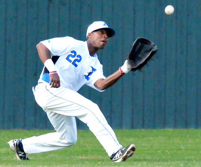 Marcus Wilson ranges to his left to haul down a liner to left. (Photo by Kevin Nagle)