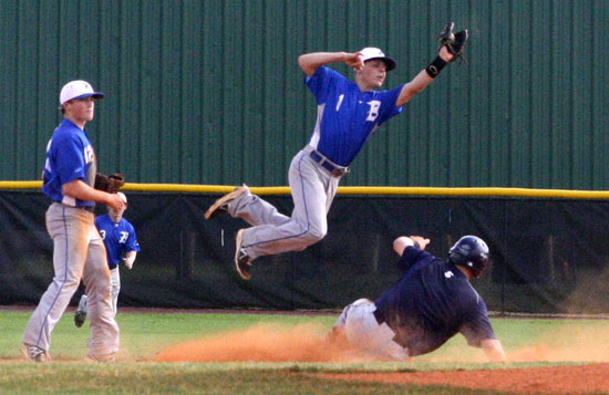 Korey Thompson leaps for a throw to second in front of teammates Trevor Ezell, left, and Tyler Green, background, in Bryant's win over Poly Prep of Brooklyn, N.Y. (Photo by courtesy of Jann Boyd Lessenberry)