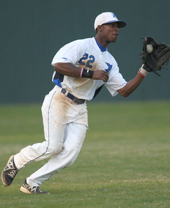 Marcus Wilson fields a ball in left. (Photo by Rick Nation)