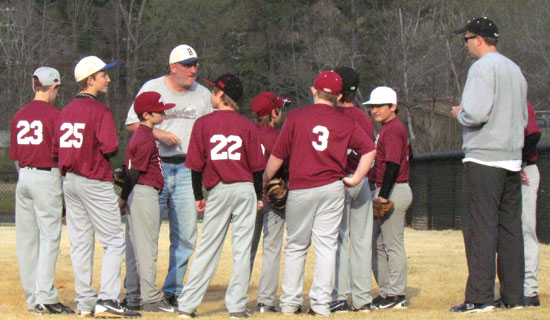 Coach Mark Coppock, middle, and Madison McEntire meet with the State Farm team. (Photo courtesy of Lara James)