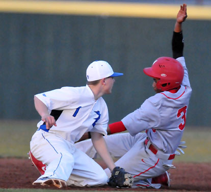 Bryant's Korey Thompson tags out Maumelle's Aaron Fagen as he tries to steal second base in the top of the fifth. (Photo by Kevin Nagle)