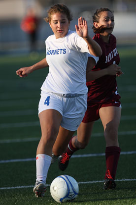 Bryant's Addie Chaloupka, left, battles for possession. (Photo by Rick Nation)