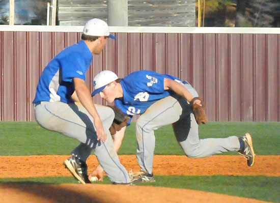 Shortstop Trevor Ezell bare-hands a ball, which had been tipped by pitcher Nate Rutherford that third baseman Brandan Warner couldn't get to. He would throw in time for an out. (Photo by Kevin Nagle)